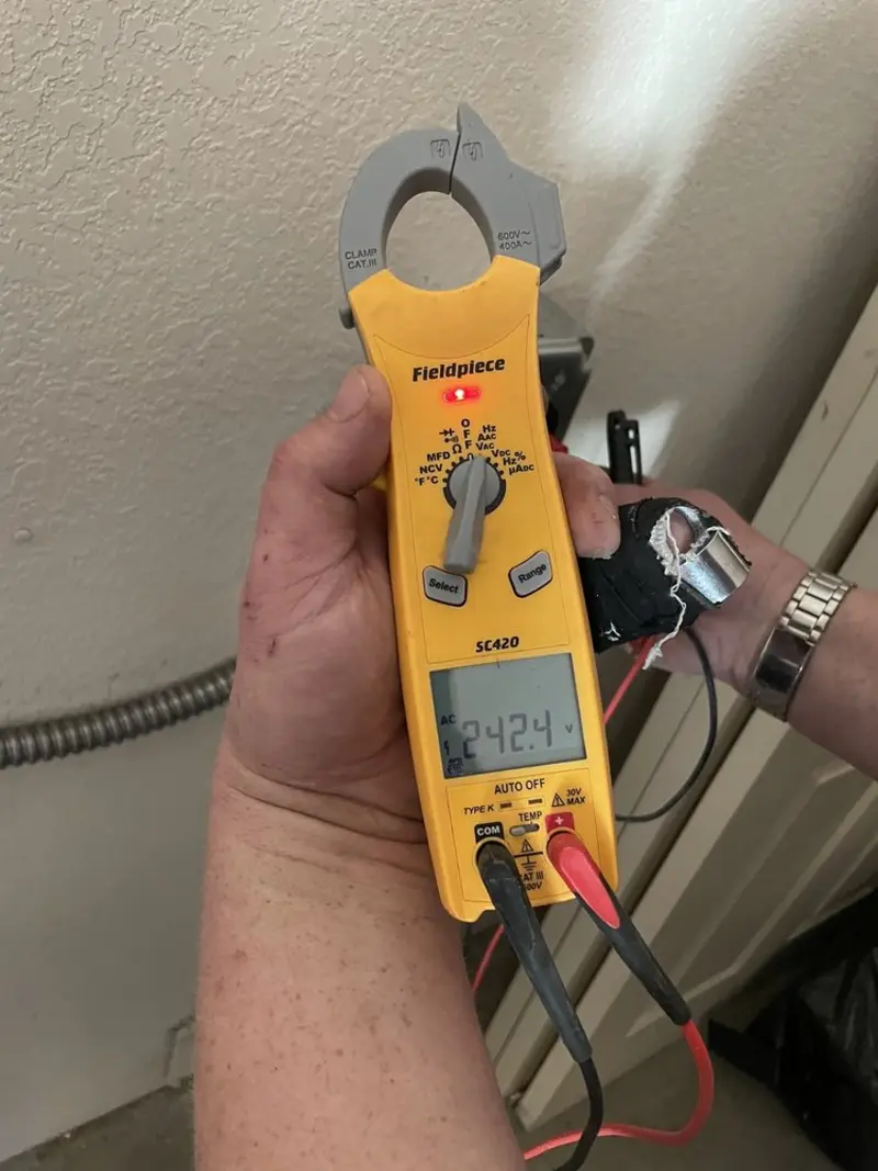 Voltage testing with clamp meter during Ceiling Fan Installation in Hampton